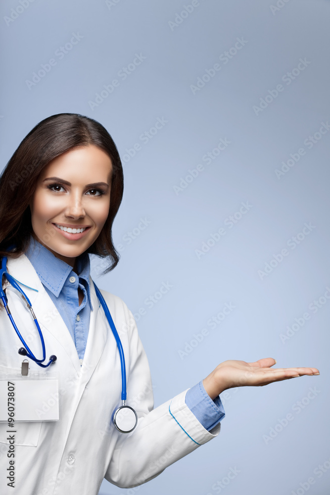 Doctor showing something, on grey