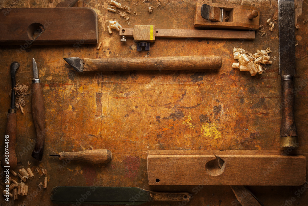 Hand tools Wood on an old wooden workbench Hand tools Wood on an old wooden workbench