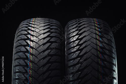 Winter tires isolated on black