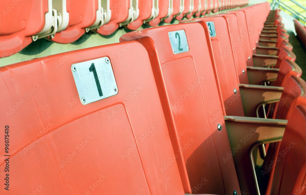 Empty red seating in sport stadium, Selective focus Empty red seating in sport stadium, Selective focus