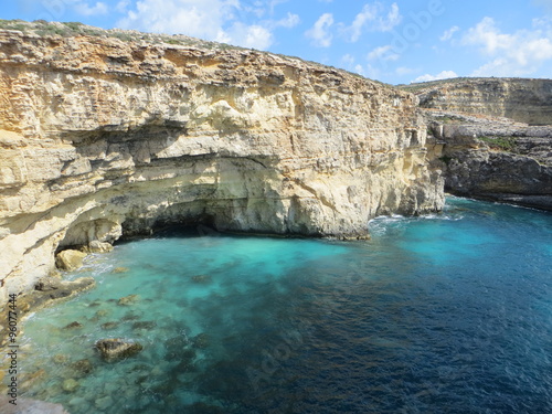 Blue lagoon with yellow rocks / Seascape of blue lagoon with yellow rocks on Gozo island © shuliak