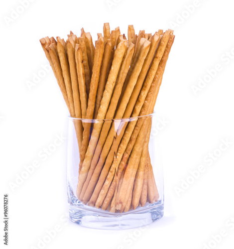 Salty sticks standing in a glass isolated