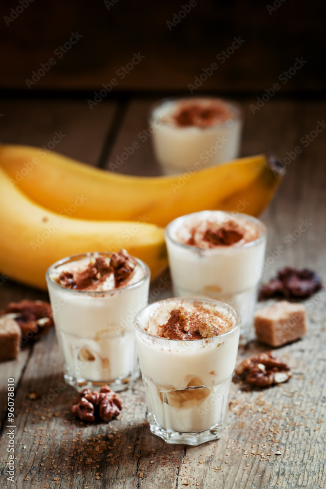 Fresh homemade dessert of bananas, yogurt and nuts, selective fo Fresh homemade dessert of bananas, yogurt and nuts, selective fo