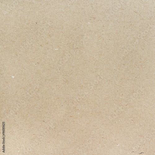 Carton beige texture, paperboard sheet as background.