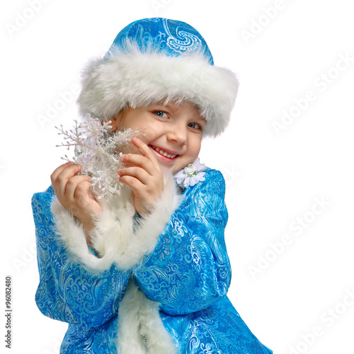 little girl dressed in the costume of Snow Maiden