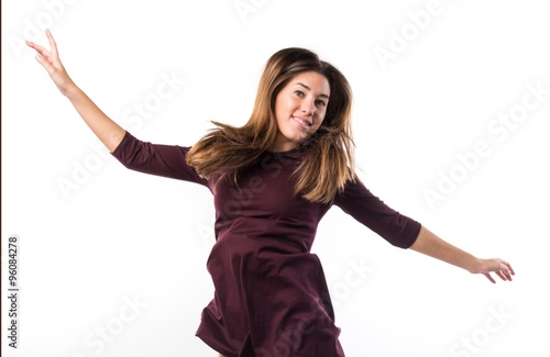 Pretty woman in studio dancing