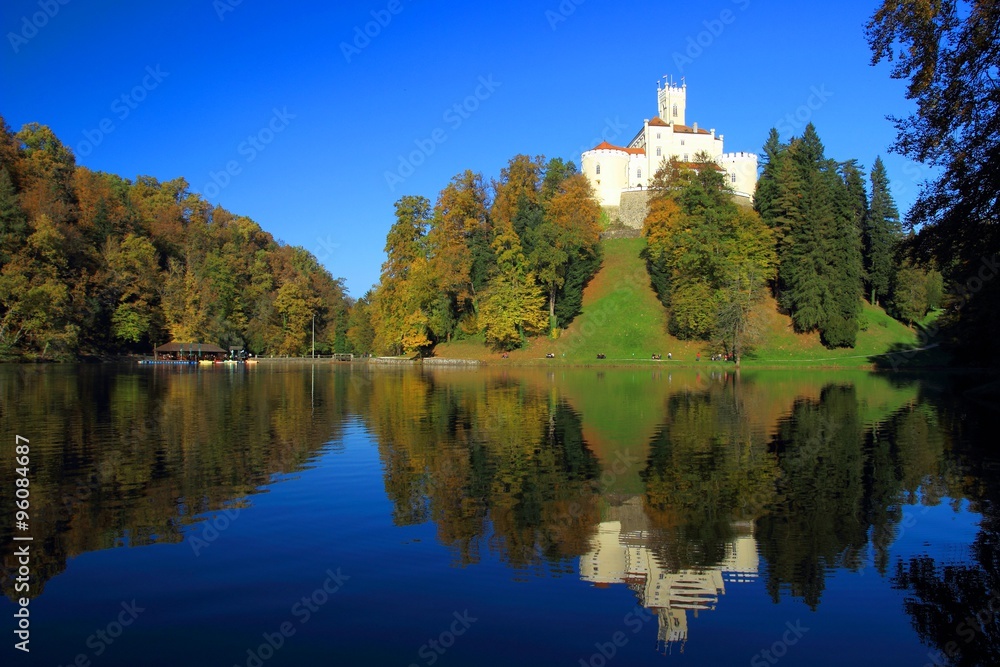Beautiful castle Trakoscan in Croatia, on hill, reflection in lake Beautiful castle Trakoscan in Croatia, on hill, reflection in lake