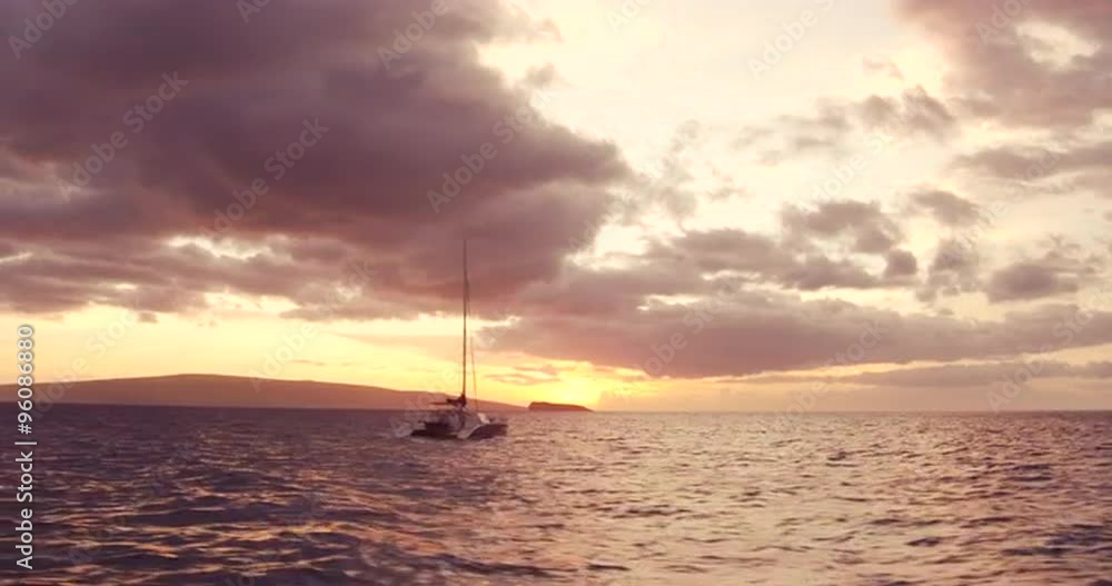 Sailing into the Sunset. Aerial View Flying Over Sail Boat. Shot in 4K. Amazing Vibrant Sunset in Hawaii Sailing into the Sunset. Aerial View Flying Over Sail Boat. Shot in 4K. Amazing Vibrant Sunset in Hawaii