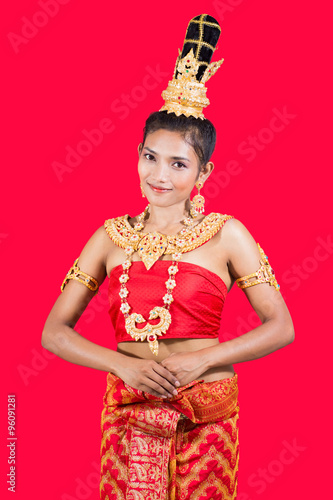 Thai lady in traditional pose on red background