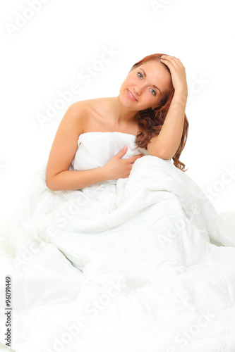 red-haired young girl in blankets