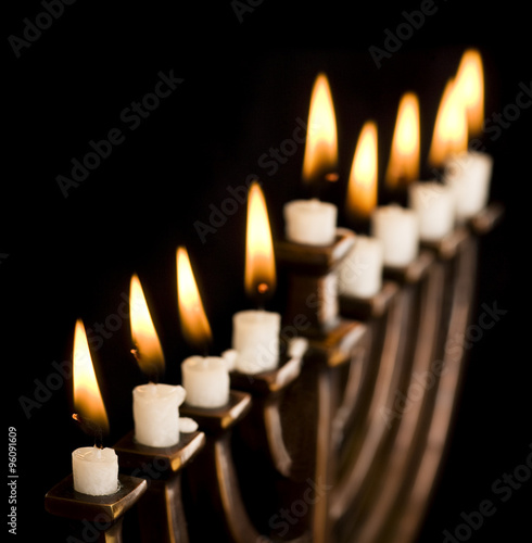 Obraz na płótnie Beautiful lit hanukkah menorah on black.