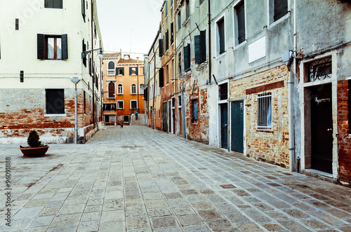 Traditional street view of old buildings in Venice © ilolab