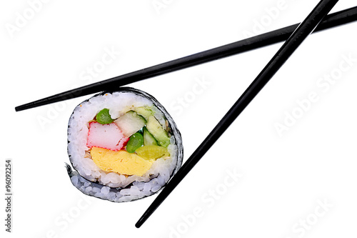 Sushi and chopsticks isolated on white.
