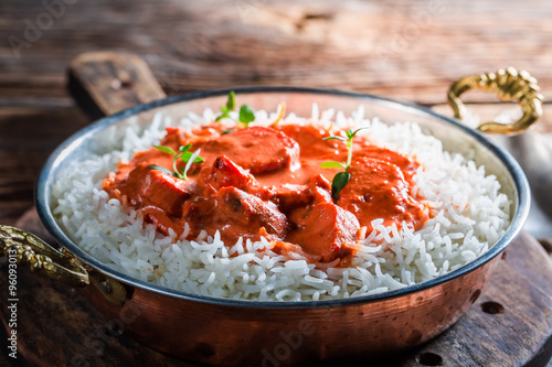 Sweet and spicy tikka masala with rice and tomato sauce