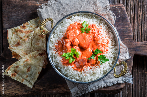 Quadro su tela Sweet and spicy tikka masala with rice and sauce
