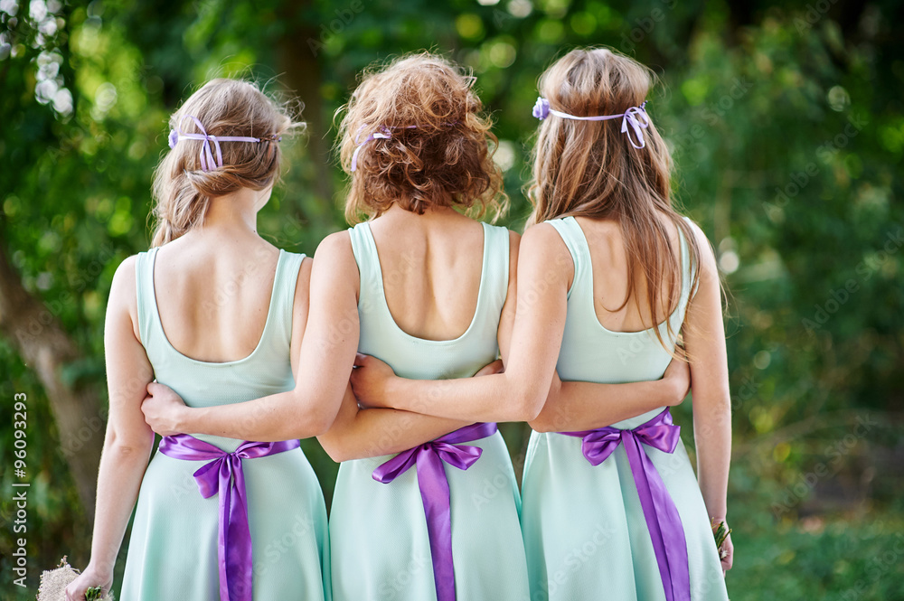 three bridesmaids are back in the park