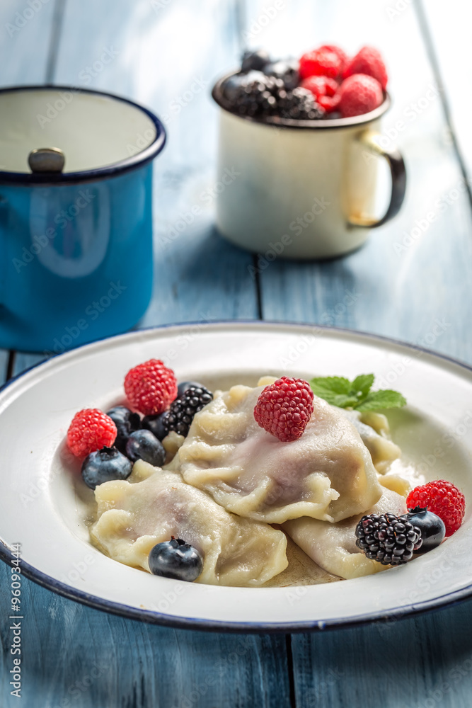 Delicious dumplings with berry fruits and cream Delicious dumplings with berry fruits and cream