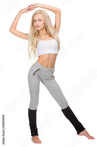 Young slim beautiful woman warming up before working out