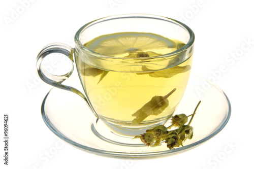 Herbal tea, sage leaves and lemon slice isolated on white background
