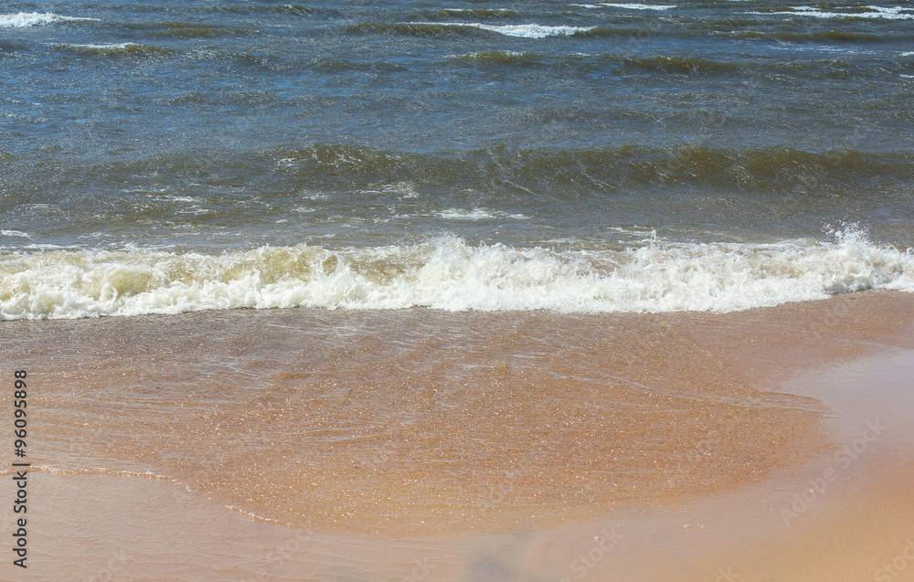 waves run on the sand