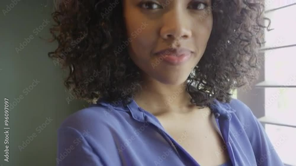 Attractive African woman smiling at camera Attractive African woman smiling at camera