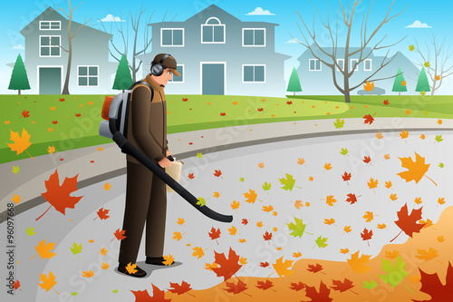 Man Clean Up Leaves During Fall Season Using a Blower