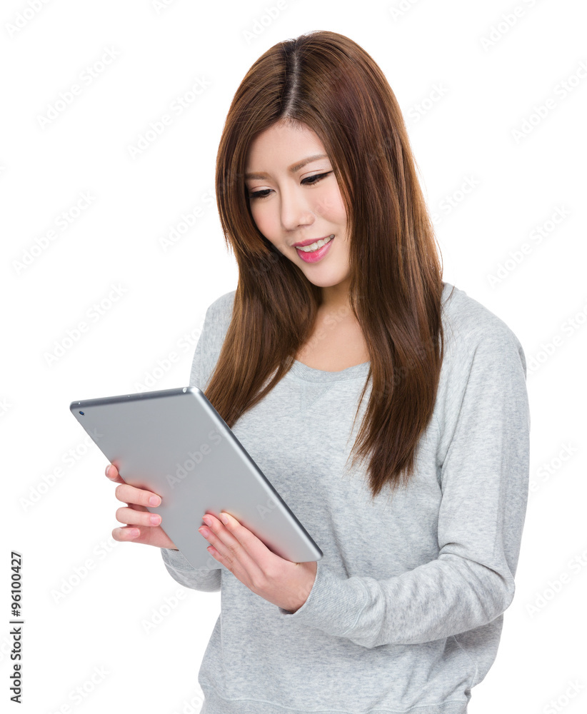 Asian Woman working with the tablet pc Asian Woman working with the tablet pc