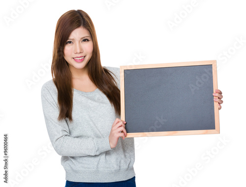 Woman showing with the blank of chalkboard