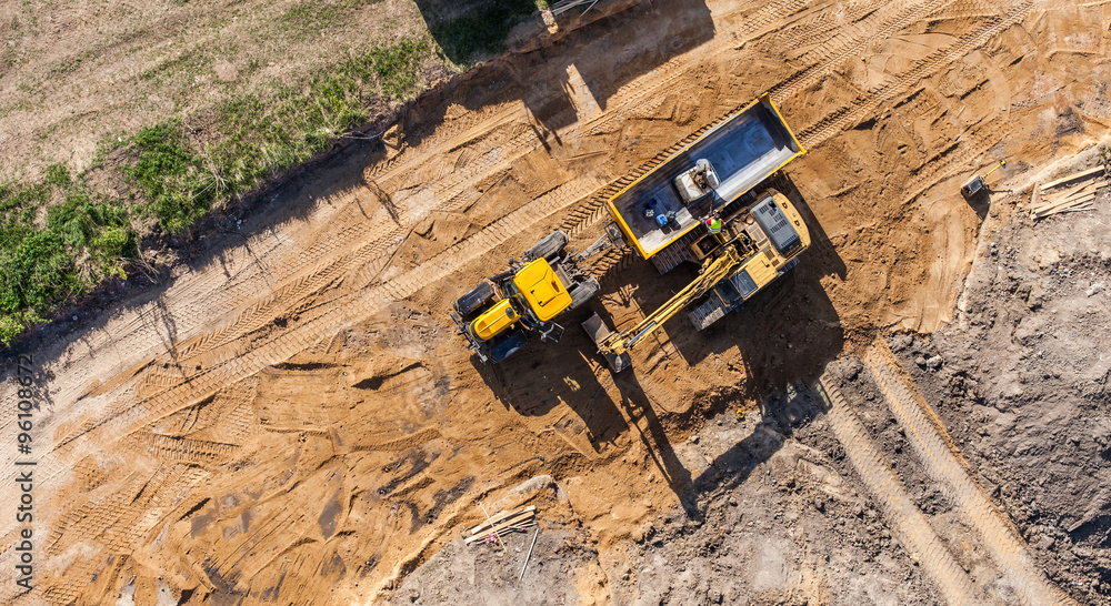 aerial view of excavator working on the field aerial view of excavator working on the field
