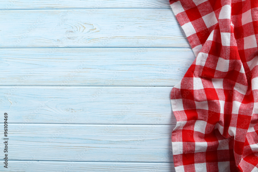 Obraz premium Napkin on blue wooden table, close up