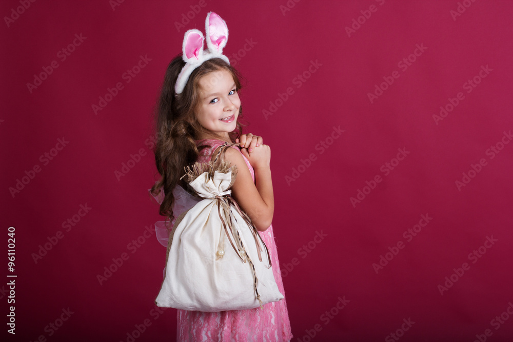 Child girl is wearing rabbit ears, christmas time