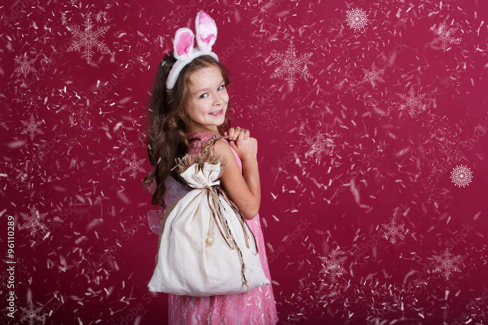 Child girl with pink is wearing bunny's ears Child girl with pink is wearing bunny's ears