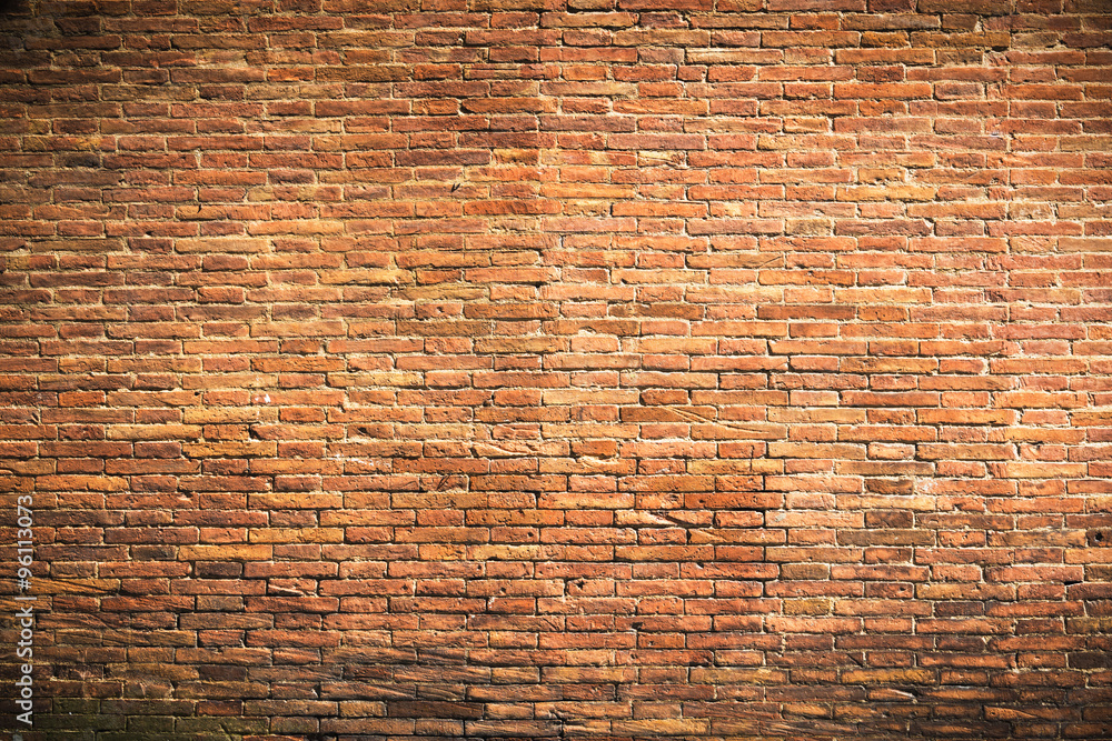 Naklejka premium Fantastic brick wall of red clay bricks as a background