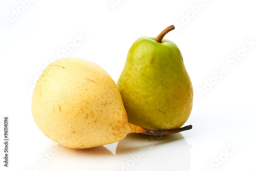 Green and yellow pears isolated on white