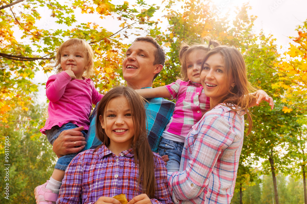 Fototapeta premium Family with beautiful little girls in autumn park