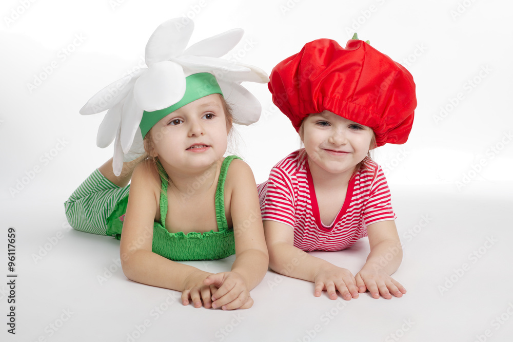 Two little girls with vegetation costumes