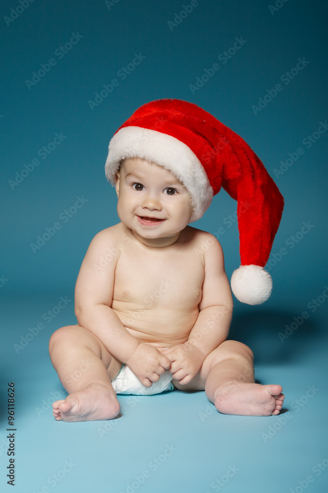 boy in diapers with hat of Santa Claus boy in diapers with hat of Santa Claus
