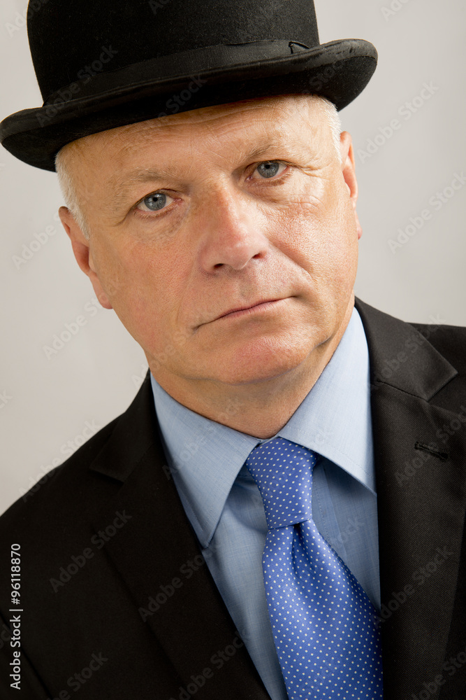 Serious Businessman Wearing Bowler Hat Serious Businessman Wearing Bowler Hat