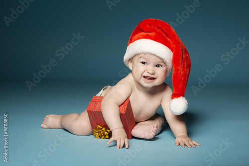boy in diapers with hat of Santa Claus