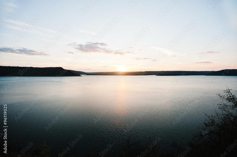 Sunset on river Dnister on reservoir Bakota, Ukraine