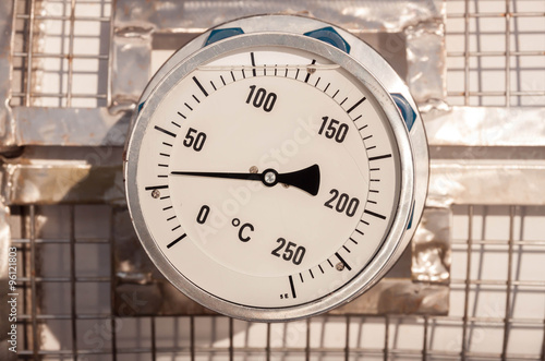 temperature gauge connect with grating pipeline background.