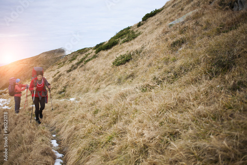 Two girls with backpacks.