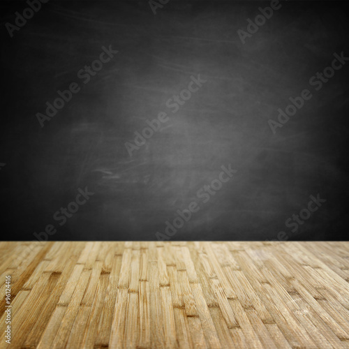 Wood floor boards and empty chalkboard background