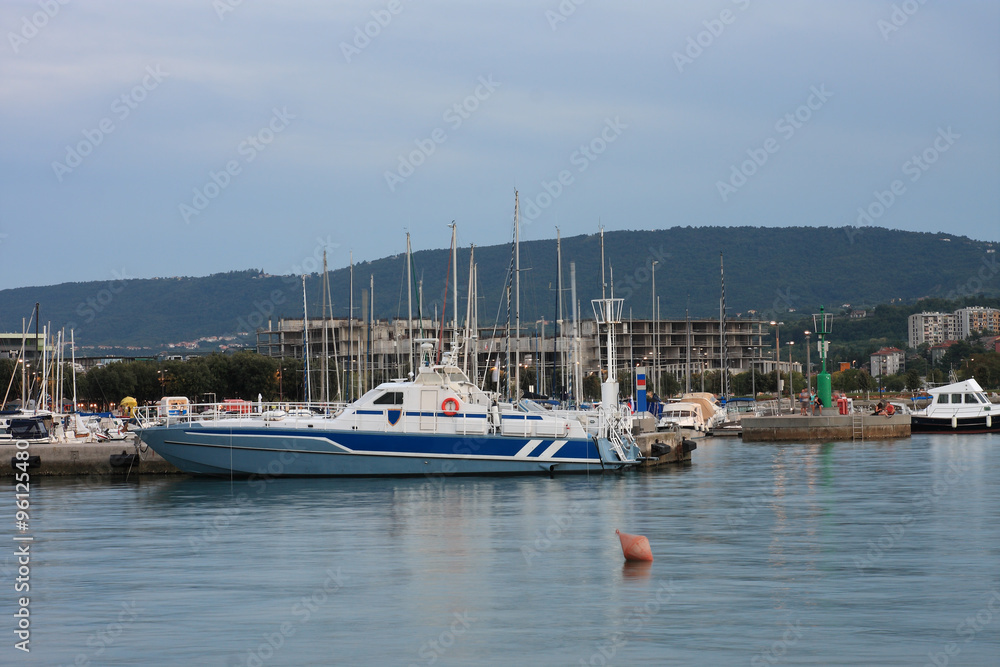 Police  boat moored in harbor in Koper after sunset time