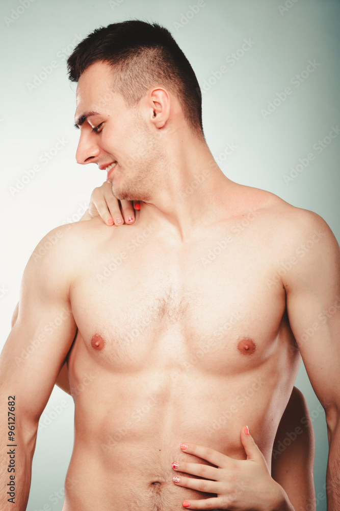 Sexy couple. Woman hands embracing half naked man. Sexy couple. Woman hands embracing half naked man.