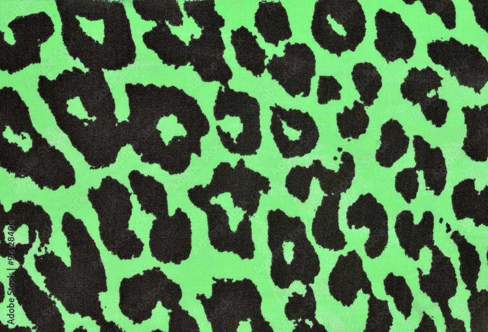 Black and green leopard fur pattern. Spotted animal print as background. Black and green leopard fur pattern. Spotted animal print as background.