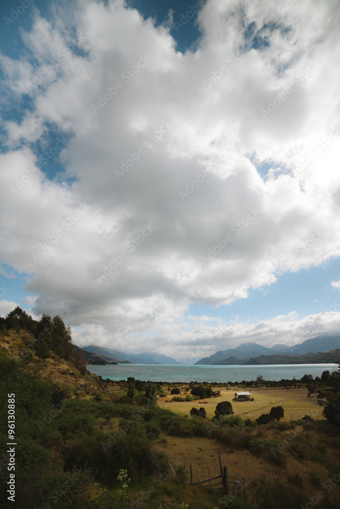 Naklejka premium Old house stands by Lago Gran Carrera - Puerto Rio Tranquilo - Chile