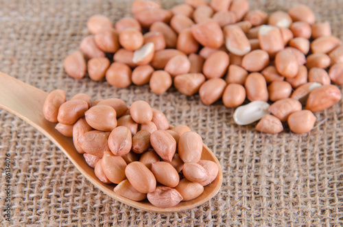 peanuts in wooden spoon