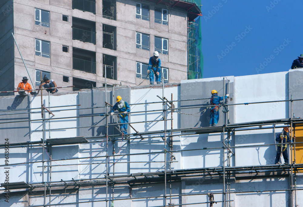 Asian construction worker scraffold, building site