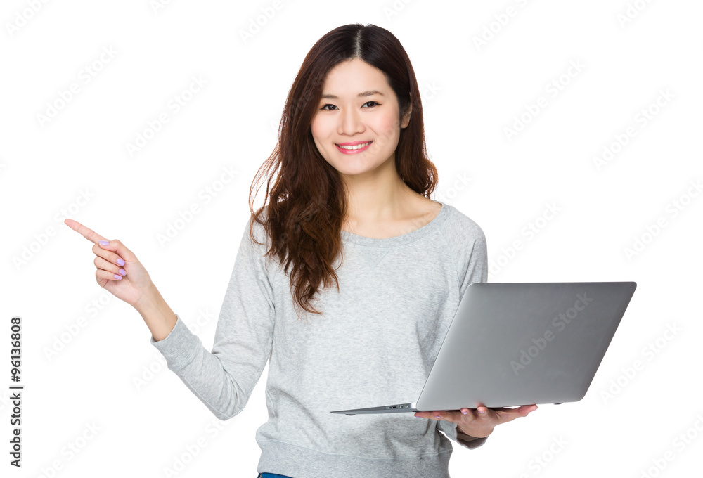 Young Woman hold with notebook computer and finger point up Young Woman hold with notebook computer and finger point up